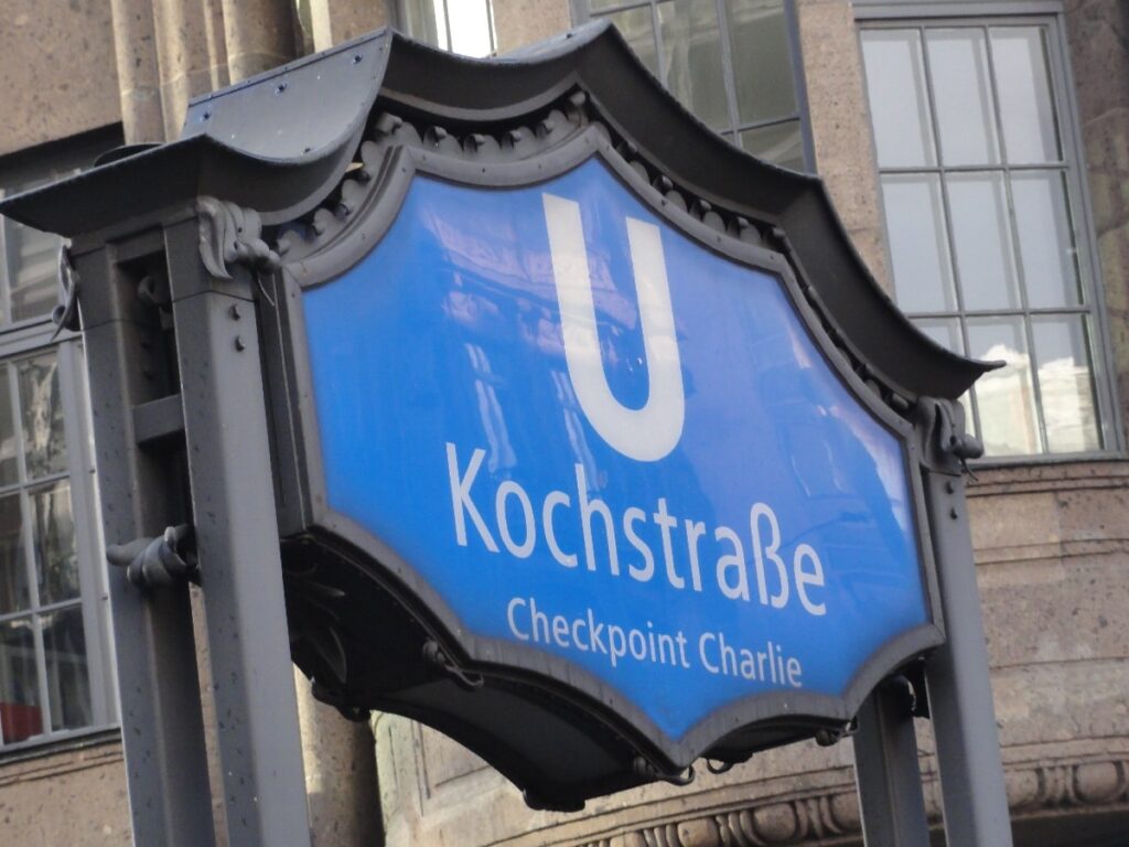 A blue U-Bahn sign marks Kochstraße and Checkpoint Charlie, the former Cold War border crossing on a Berlin sightseeing route.