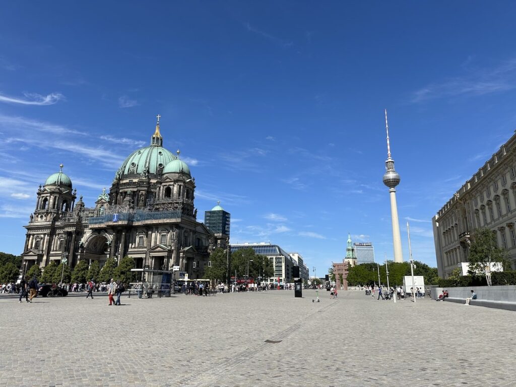 Berlin Cathedral and the Berlin TV Tower stand around a busy cobbled square, two landmarks on a three-day Berlin itinerary.