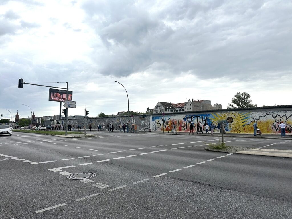 Easide Gallery Berlin wall covered with graffitis along a street